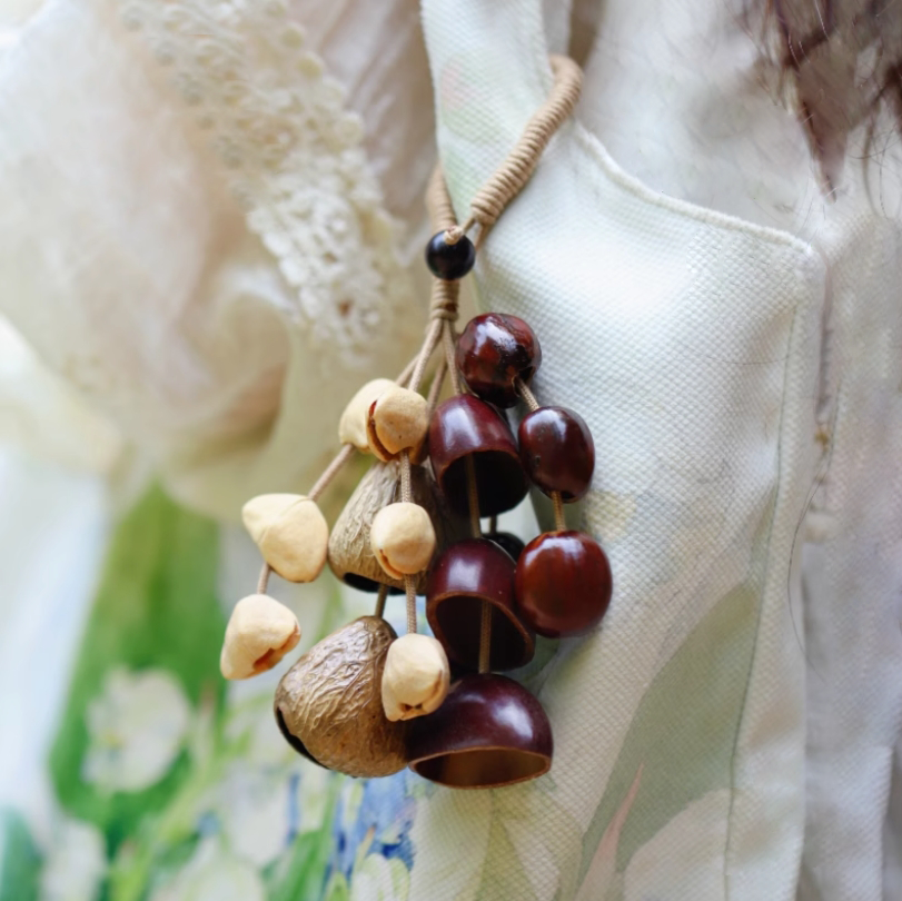 Fruit shell backpack hanging bell