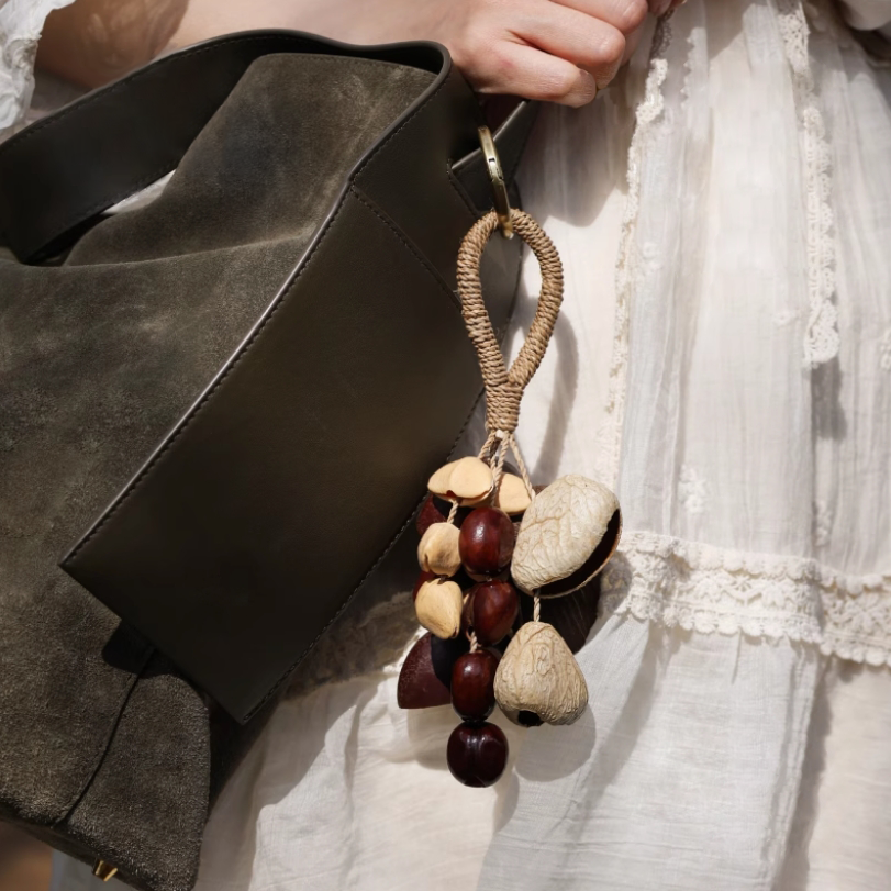 Fruit shell backpack hanging bell