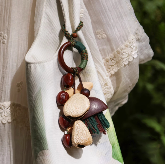 Fruit shell backpack hanging bell