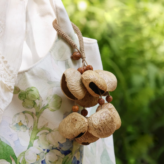 Fruit shell backpack hanging bell