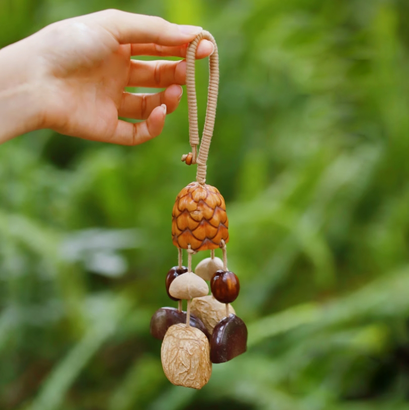 Fruit shell backpack hanging bell