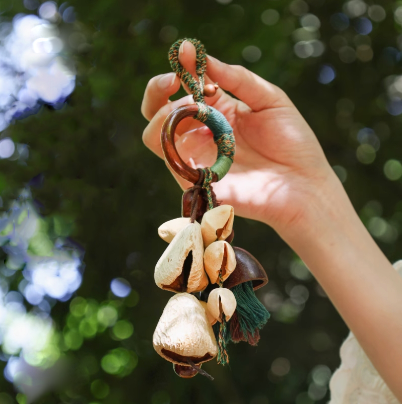 Fruit shell backpack hanging bell